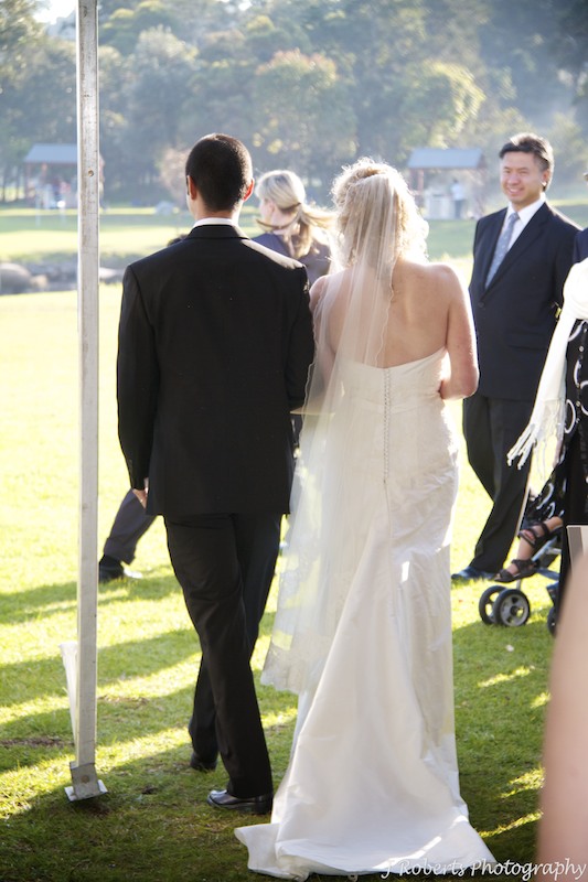 Bride and groom walking back down the aisle - wedding photography sydney
